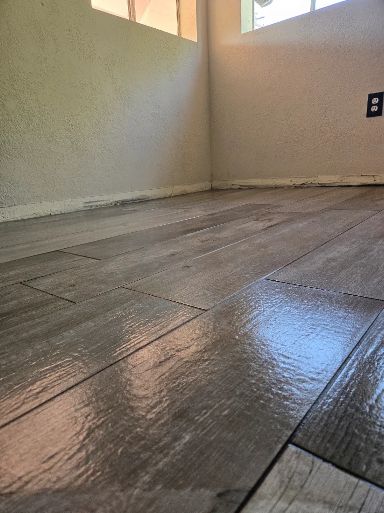 Wood-look tile flooring in a bathroom layout close-up